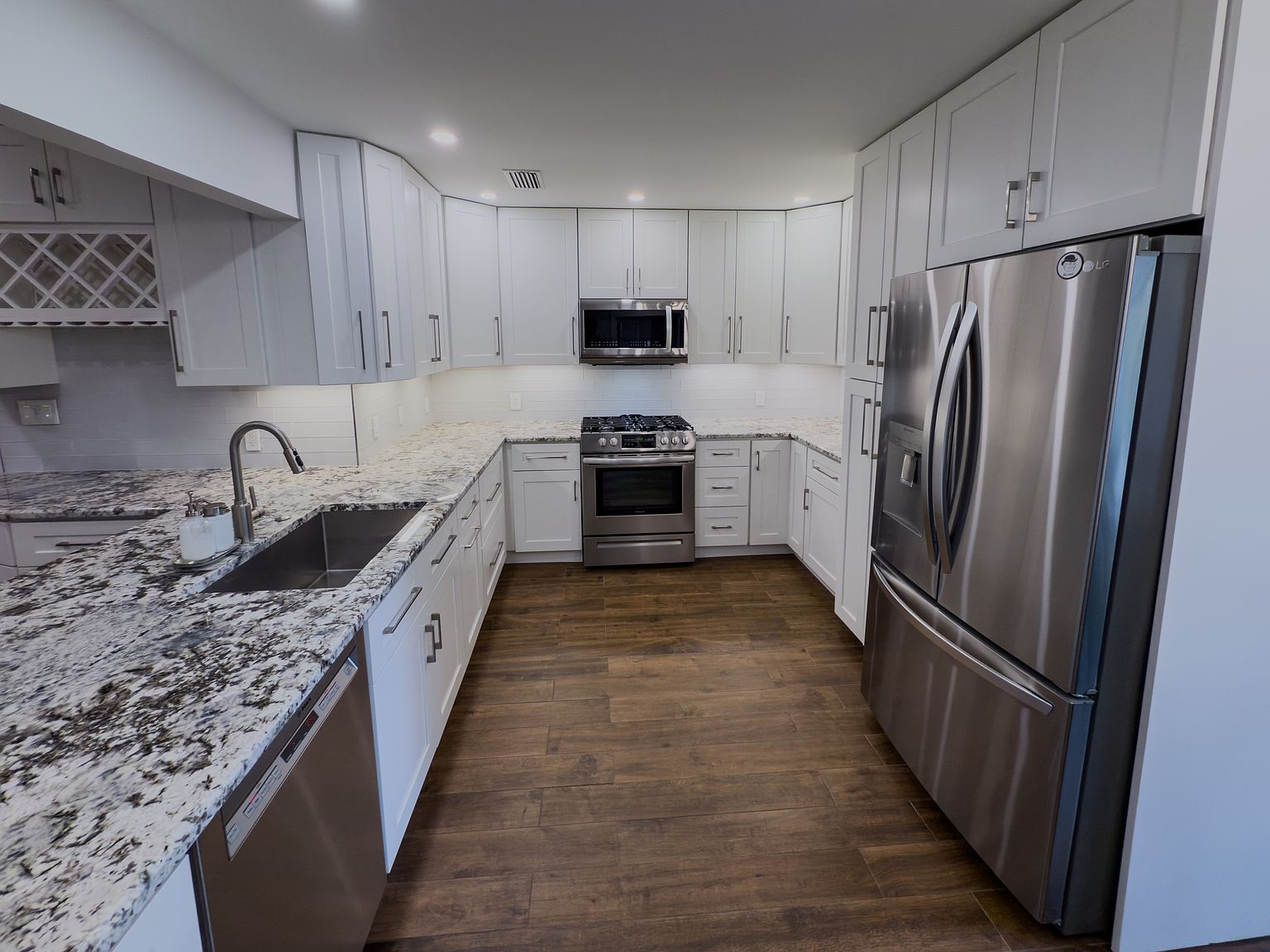 Remodeled kitchen with granite and stainless steel