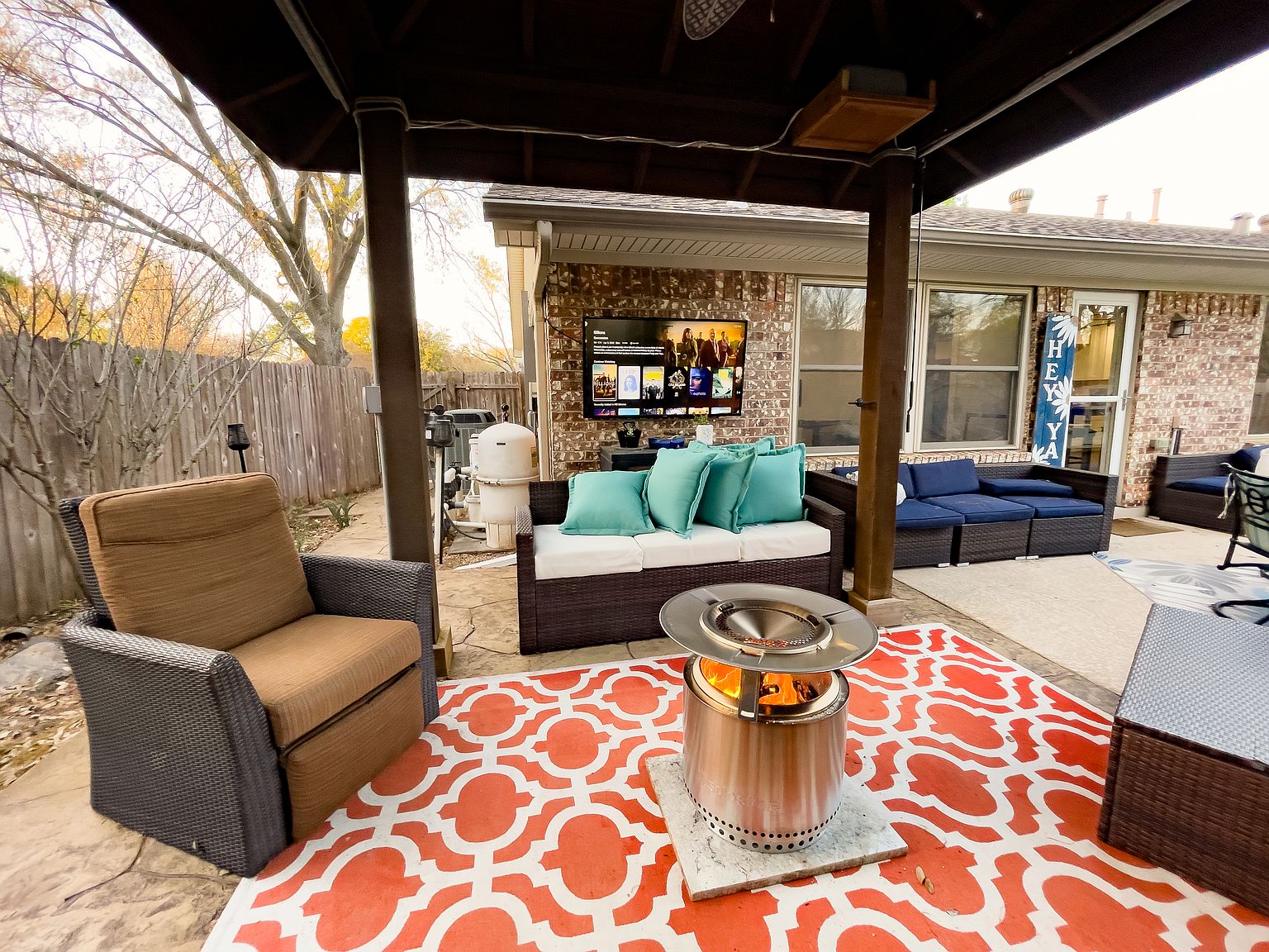 Covered patio with outdoor TV and pergola